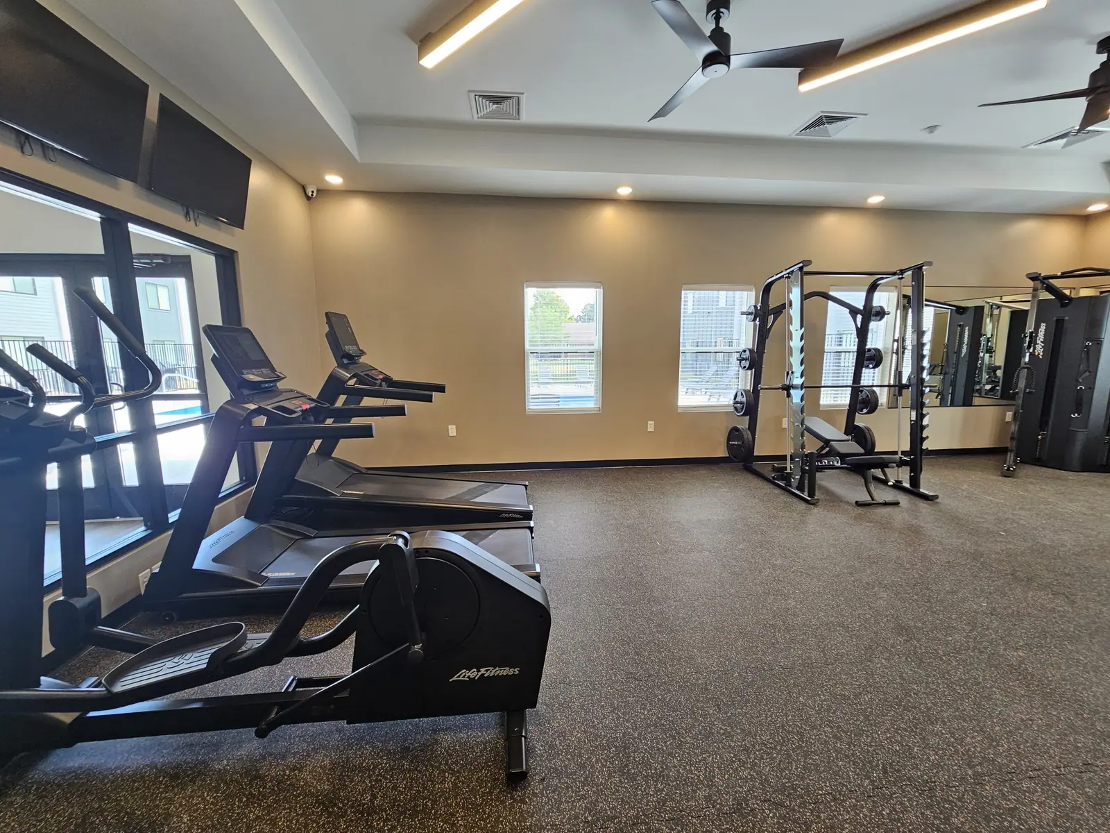 Fitness center with treadmills, elliptical and a strength rack