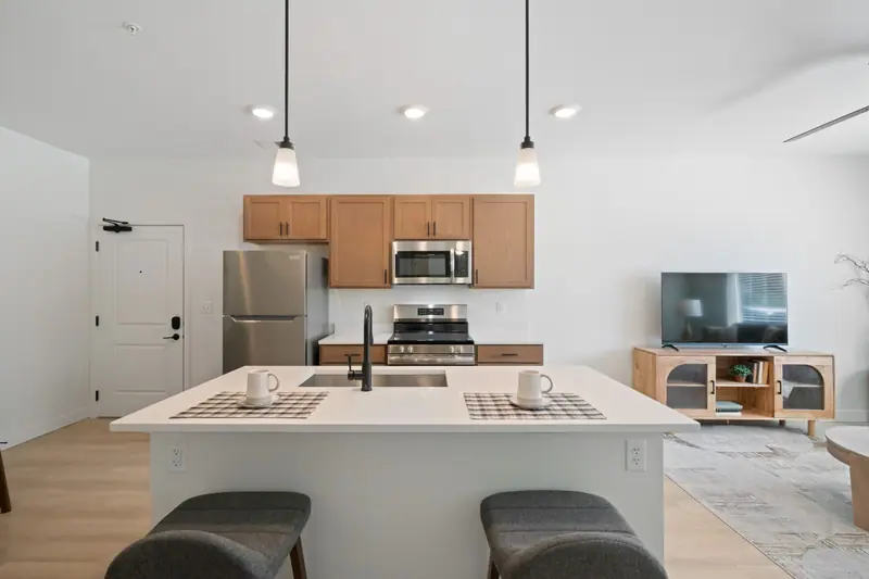 Kitchen island with quartz counters, stainless appliances and keyless entry door